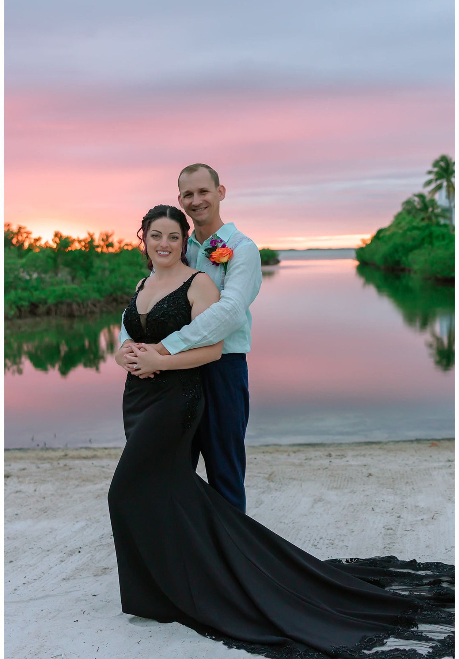 Newlyweds at sunset on the water