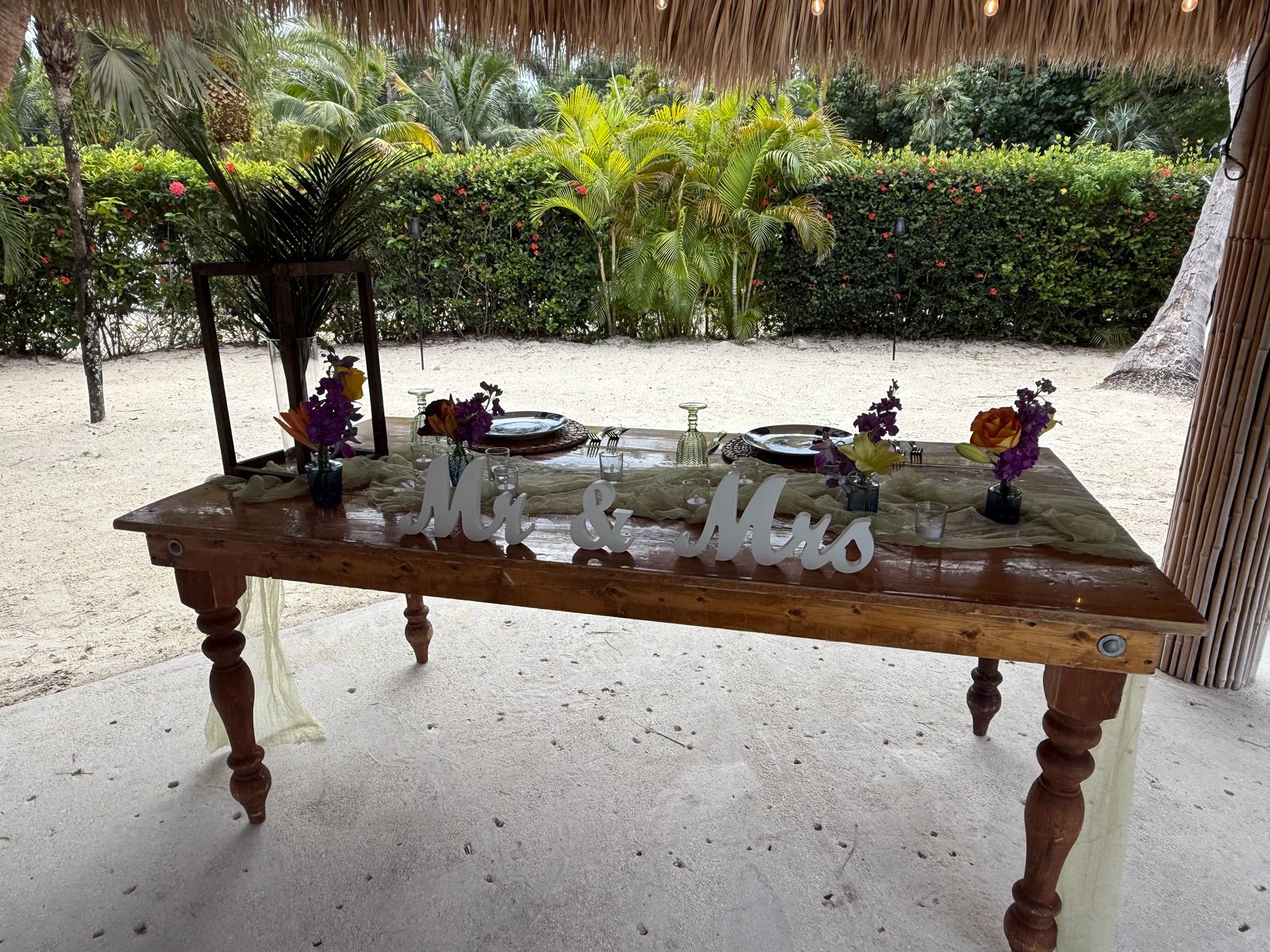 Mr and Mrs sweetheart table with tropical flowers